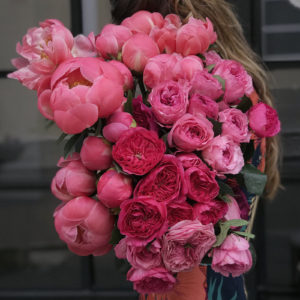 Orly Levy Blog woman holding variety of pink flowers